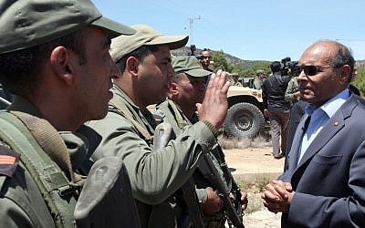 Tunisian President Moncef Marzouki visiting military officers in Jebel Chaambi, western Tunisia, close to the Algerian border, Tuesday, May 7, 2013 (photo credit: Tunisian Presidency/AP)