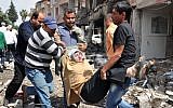 People carry a woman injured in a blast in Reyhanli, near Turkey's border with Syria, (AP Photo/Anadolu Agency, Lale Koklu)