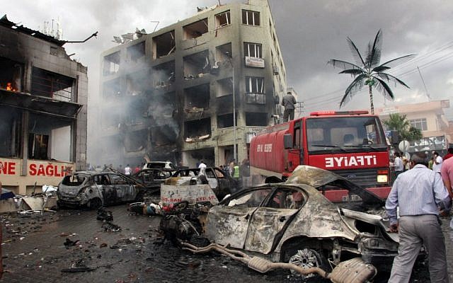 The site of one of the explosions that killed at least 40 people and injured dozens in Reyhanli, near Turkey's border with Syria, Saturday, May 11, 2013. (AP Photo/IHA) The site of one of the explosions that killed at least 40 people and injured dozens in Reyhanli, near Turkey's border with Syria, Saturday, May 11, 2013. (AP Photo/IHA)