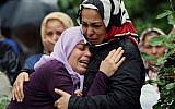 Mourning relatives during the burial of one of the 46 victims killed in Saturday explosions in Reyhanli, near Turkey's border with Syria, Sunday, May 12, 2013. (photo credit: AP/Burhan Ozbilici)