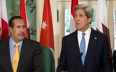 US Secretary of State John Kerry with Qatar's Prime Minister and Foreign Minister Hamad bin Jassim bin Jabr Al-Thani, second from left, and Arab League Secretary-General Nabil Elaraby, April 29, 2013 (photo credit: AP/Manuel Balce Ceneta)
