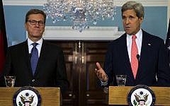 Secretary of State John Kerry, right, gestures as he speaks during a news conference with German Foreign Minister Guido Westerwelle at the State Department in Washington, Friday, May 31, 2013. (photo credit: AP/Evan Vucci)