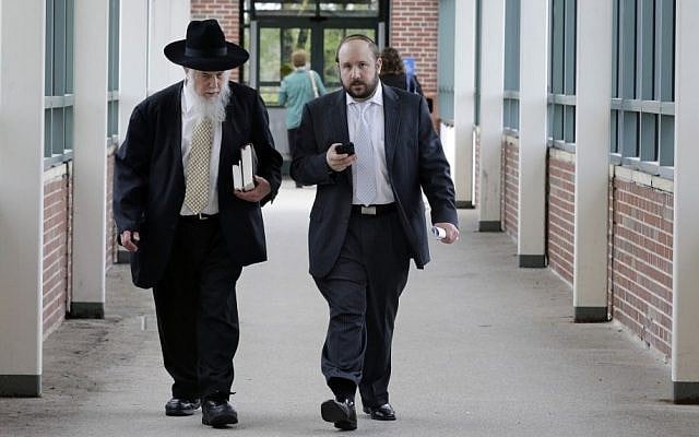 Yosef Kolko, right, walks with an unidentified man, near the Ocean County Courthouse in Toms River, NJ, Thursday, May 9, 2013, during a break in his trial on sexual assault charges. (photo credit: AP Photo/Mel Evans) Yosef Kolko, right, walks with an unidentified man, near the Ocean County Courthouse in Toms River, NJ, Thursday, May 9, 2013, during a break in his trial on sexual assault charges. (photo credit: AP Photo/Mel Evans)