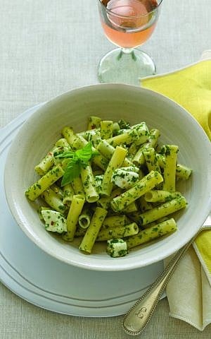 The abundance of fresh basil, parsley and arugula available in late spring adds wonderful flavor to the Ziti With Herbs and Mozzarella. (photo credit: From 'Helen Nash's New Kosher Cuisine'/JTA)