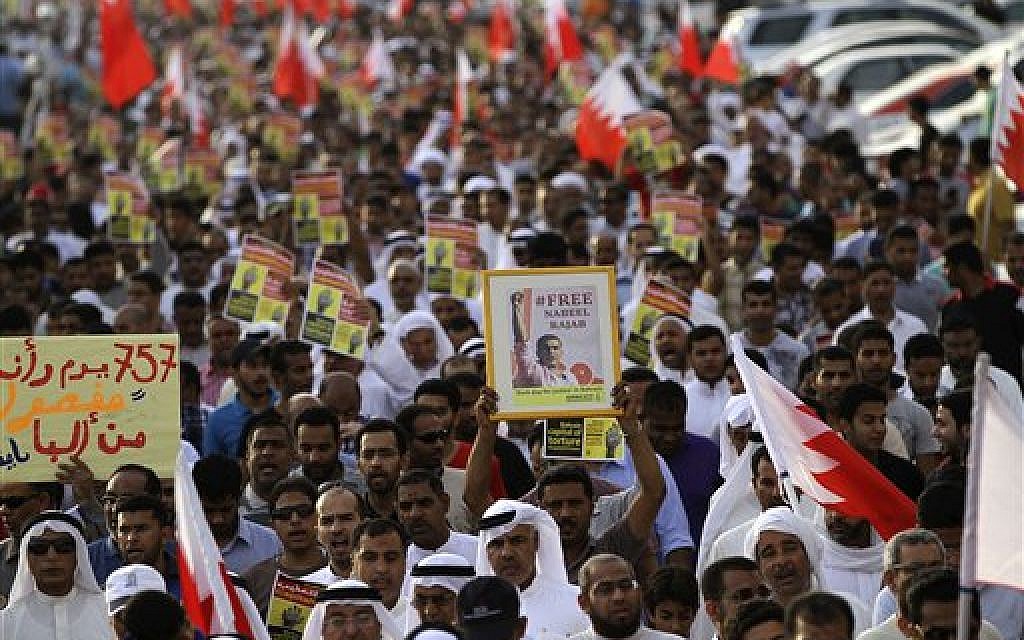 Bahraini anti-government protesters chant slogans and hold banners during a march in Daih, Bahrain, Friday, May 10, 2013. (photo credit: AP Photo/Hasan Jamali) Bahraini anti-government protesters chant slogans and hold banners during a march in Daih, Bahrain, Friday, May 10, 2013. (photo credit: AP Photo/Hasan Jamali)