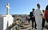 Abdellah Boutadghart, right, of the Moroccan embassy in Senegal, and Rabbi Eliezer Di Martino of Lisbon at the main cemetery in Praia for the burial of a Cape Verde resident, May 2, 2013. (Cnaan Liphshiz/JTA)
