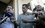 Athens' Mayor Giorgos Kaminis, left, is planning to ban a 'racist' Golden Dawn event. (photo credit: AP Photo/Petros Giannakouris)