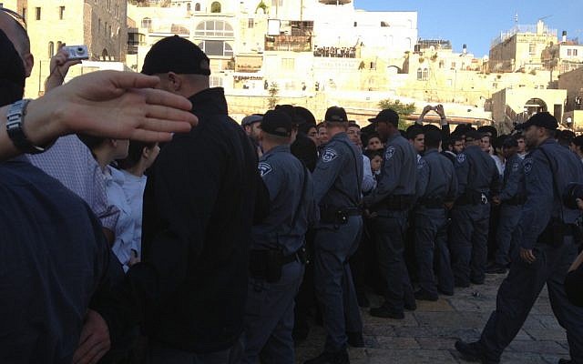 Border Police barricade part of the Western Wall plaza Friday morning as Women of the Wall make their way to the Jewish site to hold prayers on the first of the month of Sivan. (photo credit: Michal Shmulovich/Times of Israel staff)