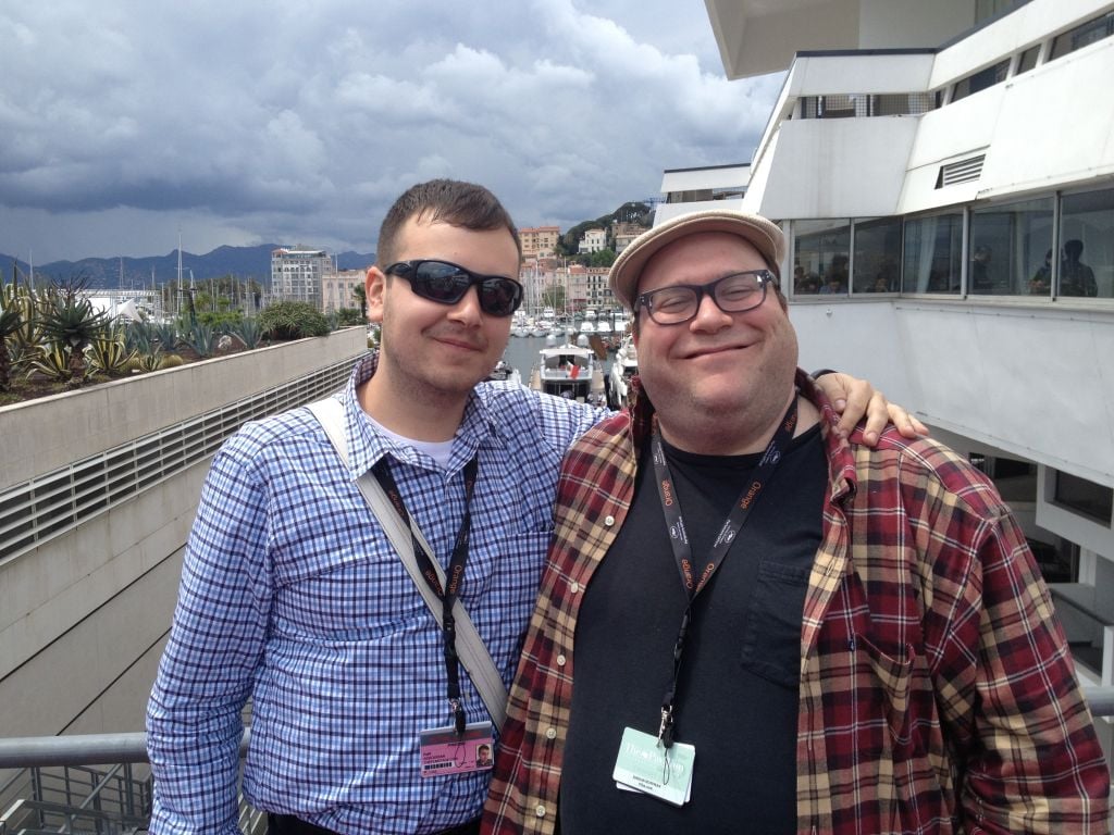 Jordan Hoffman (right) with his beloved blue pass and companion at Le Palais. (photo credit: Jordan Hoffman)