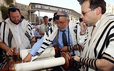 Mariusz Aoflko (center) celebrates his bar mitzvah at the Western Wall (photo credit: Sasson Tiram/Shavei Israel)
