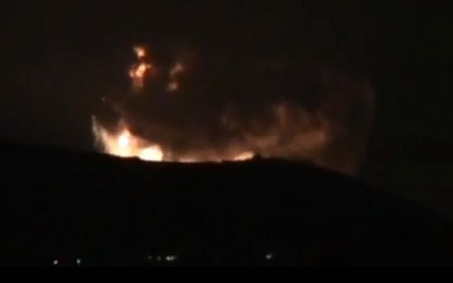 A screenshot from a video purporting to show large explosions on the outskirts of Damascus early Sunday morning. (Screenshot via YouTube)