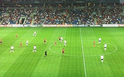 Spain (in red) play Germany at the Under-21 Championships, Sunday (photo credit: Aaron Kalman)