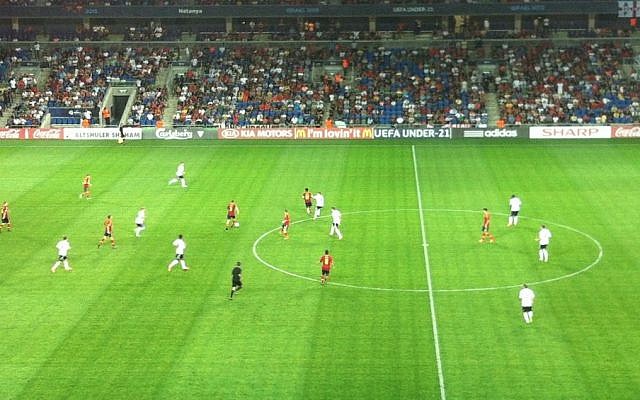 Spain (in red) play Germany at the Under-21 Championships, Sunday (photo credit: Aaron Kalman) Spain (in red) play Germany at the Under-21 Championships, Sunday (photo credit: Aaron Kalman)