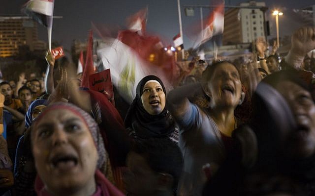 Egyptian women chant slogans against President Mohammed Morsi during a demonstration in in Tahrir Square in Cairo, Thursday, June 27, 2013 (photo credit: AP/Manu Brabo) Egyptian women chant slogans against President Mohammed Morsi during a demonstration in in Tahrir Square in Cairo, Thursday, June 27, 2013 (photo credit: AP/Manu Brabo)