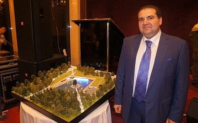 WFRJ President Alexander Levin standing next to a model of the new museum complex to built at Babi Yar (photo credit: Shimon Briman)