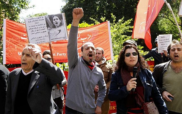 Anti-Iranian government protesters demonstrate outside the Iranian Consulate in London where Iranian nationals were voting in the Iran presidential election, Friday, June 14, 2013. (photo credit: AP Photo/Sang Tan) Anti-Iranian government protesters demonstrate outside the Iranian Consulate in London where Iranian nationals were voting in the Iran presidential election, Friday, June 14, 2013. (photo credit: AP Photo/Sang Tan)