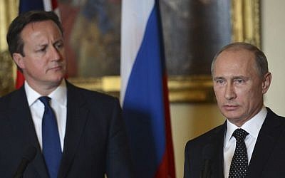 British Prime Minister David Cameron, left, stands with Russian President Vladimir Putin during a press conference at 10 Downing Street in London, on Sunday June 16, 2013. (photo credit: AP Photo/Anthony Devlin)