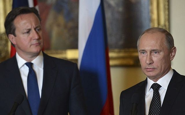British Prime Minister David Cameron, left, stands with Russian President Vladimir Putin during a press conference at 10 Downing Street in London, on Sunday June 16, 2013. (photo credit: AP Photo/Anthony Devlin) British Prime Minister David Cameron, left, stands with Russian President Vladimir Putin during a press conference at 10 Downing Street in London, on Sunday June 16, 2013. (photo credit: AP Photo/Anthony Devlin)