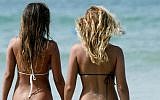 Illustrative photo of two women at the beach in Tel Aviv. (photo credit: Moshe Shai/Flash90)
