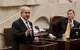 Knesset Speaker Yuli Edelstein looks on as PM Benjamin Netanyahu speaks at the plenum in the Knesset, April 24, 2013. (photo credit: Flash 90)