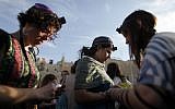 Women of the Wall members pray while wearing traditional prayer shawls and tefillin, May 2013. (photo credit: Flash90)