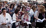 Women of the Wall members wearing prayer shawls pray at the Western Wall (photo credit: Sarah Schuman/Flash90)