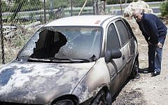 Illustrative photo of a vehicle that was allegedly torched by Israeli settlers in a 'price tag' attack, June 2013. (Yonatan Sindel/Flash90)