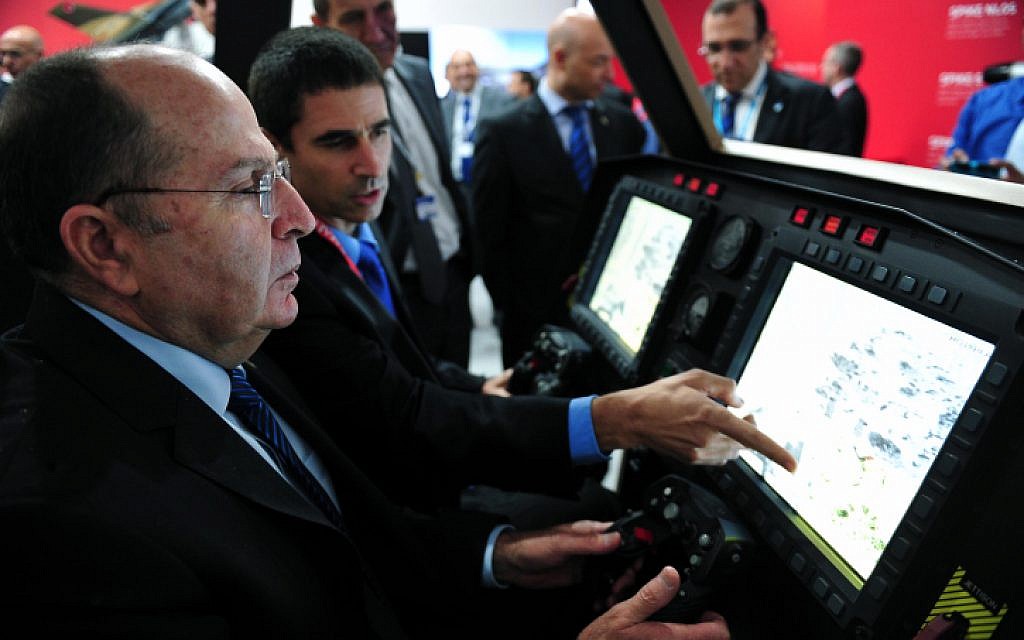 Defense Minister Moshe Ya'alon at the inauguration ceremony of the Israeli pavilion at a previous annual air show in Paris, France. (Ariel Hermoni/DefenseMinistry/Flash90)