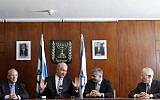 (From left) Jacob Frenkel, Prime Minister Benjamin Netanyahu, Finance Minister Yair Lapid and outgoing Bank of Israel Governor Stanley Fischer at a press conference in the Knesset in Jerusalem, on June 24, 2013. (photo credit: Miriam Alster/Flash90)
