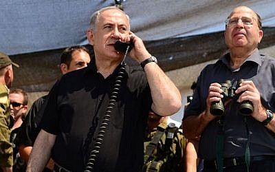 Prime Minister Benjamin Netanyahu and Defense Minister Moshe Ya'alon observe a drill of the Golani Brigade in the Golan Heights, Wednesday, June 26, 2013 (photo credit: Kobi Gideon/GPO/Flash90) Prime Minister Benjamin Netanyahu and Defense Minister Moshe Ya'alon observe a drill of the Golani Brigade in the Golan Heights, Wednesday, June 26, 2013 (photo credit: Kobi Gideon/GPO/Flash90)