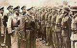 Heinrich Himmler, center, reviews troops of the Galician SS-Volunteer Infantry Division, June 3, 1944. (AP/US Holocaust Memorial Museum, Courtesy of Atlantic Foto Verlag Berlin)