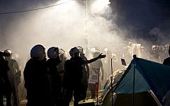 Riot police gather in Gezi park, engulfed in tear gas, in Istanbul, Turkey, Saturday, June 15, 2013 (photo credit: AP Photo/Vadim Ghirda)