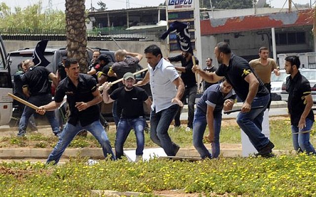 Hezbollah supporters clash with supporters of the Lebanese Option Party during a protest in front of the Iranian Embassy in Beirut, Lebanon, Sunday, June 9, 2013. (photo credit: AP) Hezbollah supporters clash with supporters of the Lebanese Option Party during a protest in front of the Iranian Embassy in Beirut, Lebanon, Sunday, June 9, 2013. (photo credit: AP)