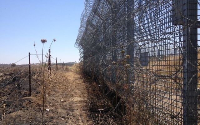 A section of Israel's new border fence, as seen from the Syrian side of the barrier (Photo credit: Mitch Ginsburg/ Times of Israel)