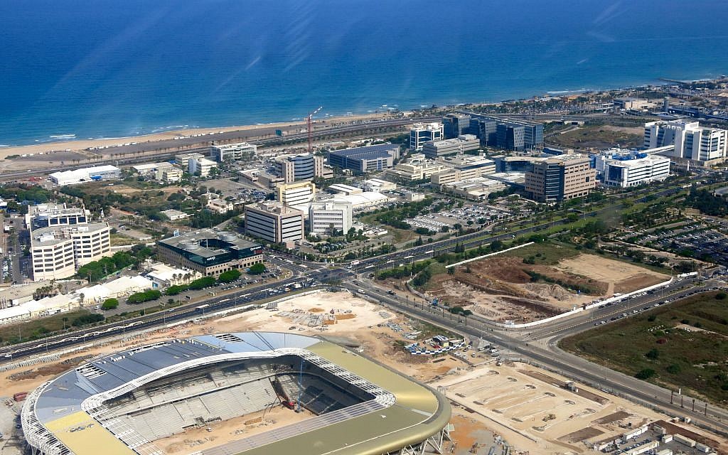 The new football stadium gleams in the morning sun.  (photo: Qanta Ahmed)