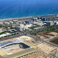The new football stadium gleams in the morning sun.  (photo: Qanta Ahmed)