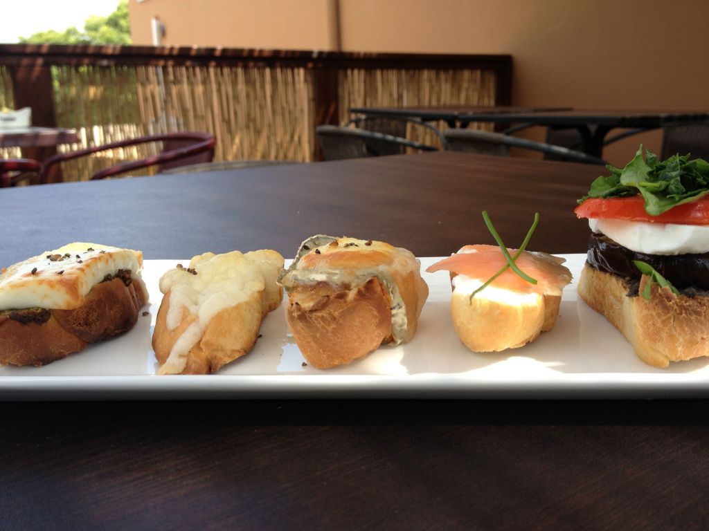 A lunch of goat-cheese-topped bruschetta (photo credit: Jessica Steinberg/Times of Israel)