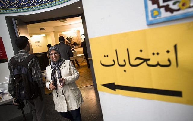 An Iranian voter smiles after casting her ballot at a polling station for Iran's presidential election, Friday, June 14, 2013, in the Queens borough of New York. (photo credit: AP/John Minchillo) An Iranian voter smiles after casting her ballot at a polling station for Iran's presidential election, Friday, June 14, 2013, in the Queens borough of New York. (photo credit: AP/John Minchillo)
