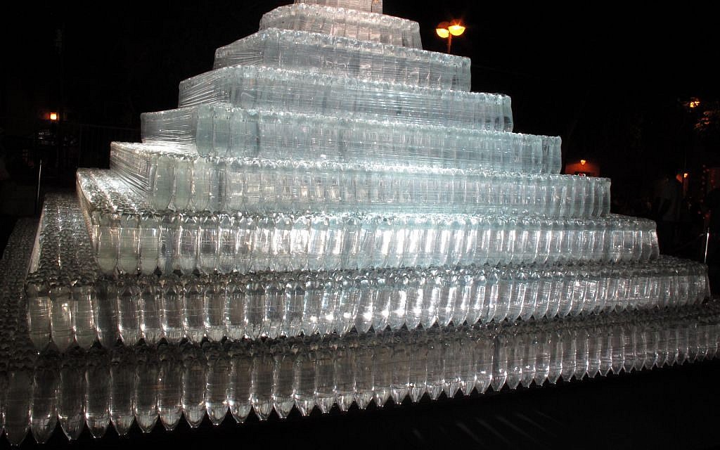 Nestled in Hurva Square, an illuminated pyramid titled 'Pyramid of Light,' by Heinz Kasper, is transparent and made of thousands of plastic bottles (photo credit: Leeor Bronis/Times of Israel)