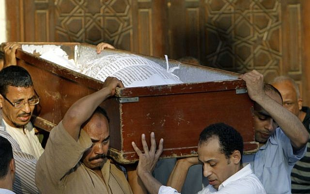 Egyptians carry the coffin of a Shiite following funeral prayers in Cairo, Egypt, Monday, June 24 (photo credit: AP/Amr Nabil) Egyptians carry the coffin of a Shiite following funeral prayers in Cairo, Egypt, Monday, June 24 (photo credit: AP/Amr Nabil)