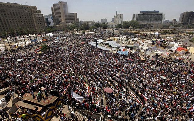 Opponents of Egypt's Islamist President Mohammed Morsi gather for noon prayers in Tahrir Square, the focal point of Egyptian uprising, in Cairo Sunday, June 30 (photo credit: AP/Amr Nabil) Opponents of Egypt's Islamist President Mohammed Morsi gather for noon prayers in Tahrir Square, the focal point of Egyptian uprising, in Cairo Sunday, June 30 (photo credit: AP/Amr Nabil)