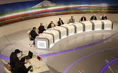 Iranian presidential candidates from right, Mohammad Gharazi, Mohammad Reza Aref, Saeed Jalili, Ali Akbar Velayati, Gholam Ali Haddad Adel, Hasan Rowhani, Mohammad Bagher Qalibaf, and Mohsen Rezaei, attend a TV debate in a state-run TV studio, in Tehran, Iran. (AP Photo/Islamic Republic of Iran Broadcasting, Mehdi Dehghan)