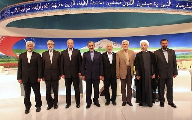 In this photo released by the Islamic Republic of Iran Broadcasting, on Friday, May 31, 2013, presidential candidates from left, Saeed Jalili, Gholam Ali Haddad Adel, Mohammad Bagher Qalibaf, Ali Akbar Velayati, Mohammad Gharazi, Mohammad Reza Aref, Hasan Rowhani, Mohsen Rezaei, pose for a group picture, after their TV debate in a state-run TV studio, in Tehran, Iran (photo credit: AP/Islamic Republic of Iran Broadcasting, Mehdi Dehghan) In this photo released by the Islamic Republic of Iran Broadcasting, on Friday, May 31, 2013, presidential candidates from left, Saeed Jalili, Gholam Ali Haddad Adel, Mohammad Bagher Qalibaf, Ali Akbar Velayati, Mohammad Gharazi, Mohammad Reza Aref, Hasan Rowhani, Mohsen Rezaei, pose for a group picture, after their TV debate in a state-run TV studio, in Tehran, Iran (photo credit: AP/Islamic Republic of Iran Broadcasting, Mehdi Dehghan)