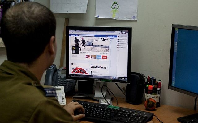 Illustrative: A soldier looks at the IDF's Facebook page at the army spokesperson's office in Jerusalem in November 2012. (photo credit: AP/Sebastian Scheiner) Illustrative: A soldier looks at the IDF's Facebook page at the army spokesperson's office in Jerusalem in November 2012. (photo credit: AP/Sebastian Scheiner)