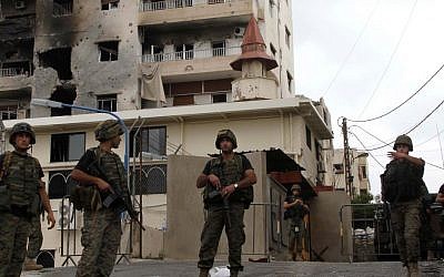 Lebanese soldiers stand guard near the mosque where Sunni cleric Sheik Ahmad al-Assir preaches, in Sidon, Lebanon, in June 2013. (photo credit: AP/Mohammed Zaatari)