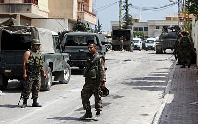 Lebanese Army soldiers during clashes that erupted between followers of a radical Sunni cleric Sheik Ahmad al-Assir and Shiite gunmen in Sidon, Lebanon, Monday, June 24 (AP Photo/Bilal Hussein)