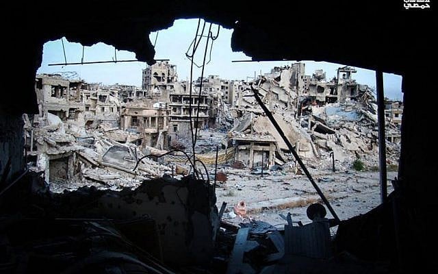 Damaged buildings in the Jouret al-Chiyah neighborhood of Homs, May 2013. (photo credit: AP/Yong Homsi Lens) Damaged buildings in the Jouret al-Chiyah neighborhood of Homs, May 2013. (photo credit: AP/Yong Homsi Lens)
