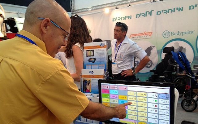 Yossi Blum, the creator of D-bur, a communications software program for the speech impaired, tests his product at the Ezertech convention held at the Israel Trade and Convention Center in Tel Aviv. (photo credit: Courtesy) Yossi Blum, the creator of D-bur, a communications software program for the speech impaired, tests his product at the Ezertech convention held at the Israel Trade and Convention Center in Tel Aviv. (photo credit: Courtesy)