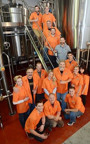 Shmaltz Brewing employees celebrating the company's new facility in suburban Albany, NY, May 13, 2013. (photo credit: Shmaltz Brewing/JTA)