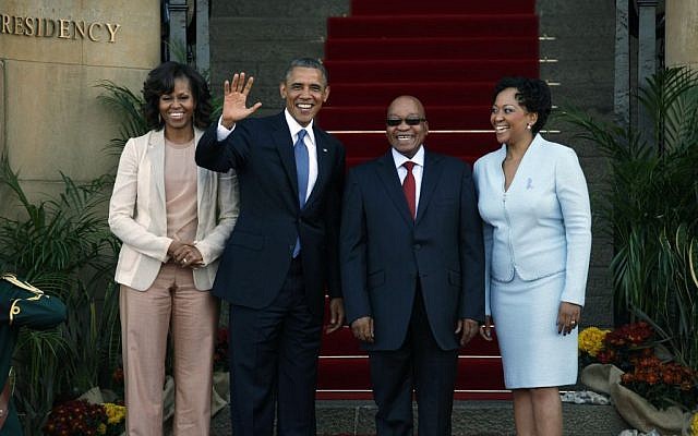 US President Barack Obama flanked by First Lady Michelle Obama, left, waves with South African President Jacob Zuma, second right, and his wife Tobeka Madiba Zuma, right, on the steps of Union Building in Pretoria, South Africa, Saturday June 29, 2013. (AP Photo/Jerome Delay) US President Barack Obama flanked by First Lady Michelle Obama, left, waves with South African President Jacob Zuma, second right, and his wife Tobeka Madiba Zuma, right, on the steps of Union Building in Pretoria, South Africa, Saturday June 29, 2013. (AP Photo/Jerome Delay)